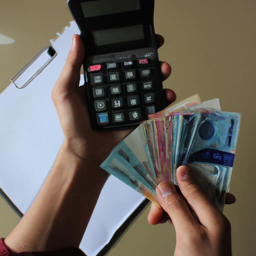 Person holding money and calculator