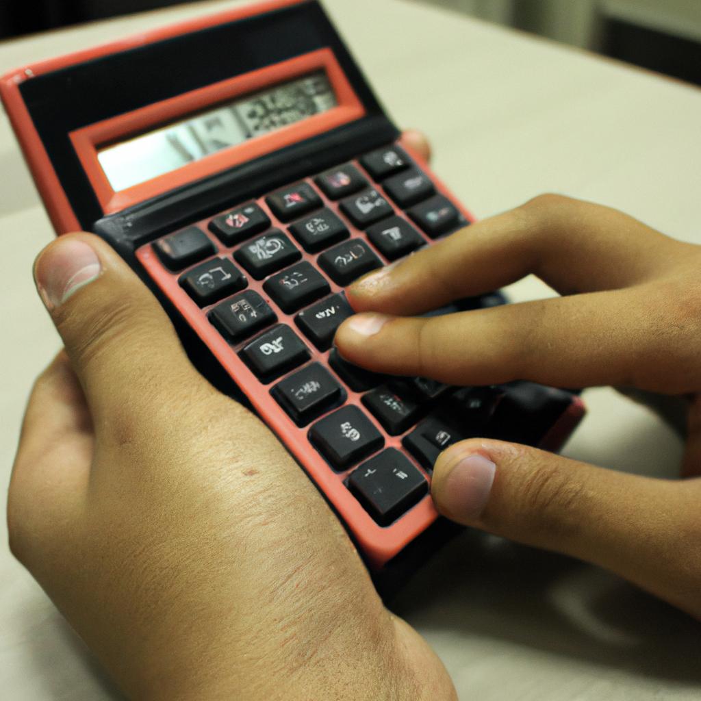 Person holding calculator, analyzing data